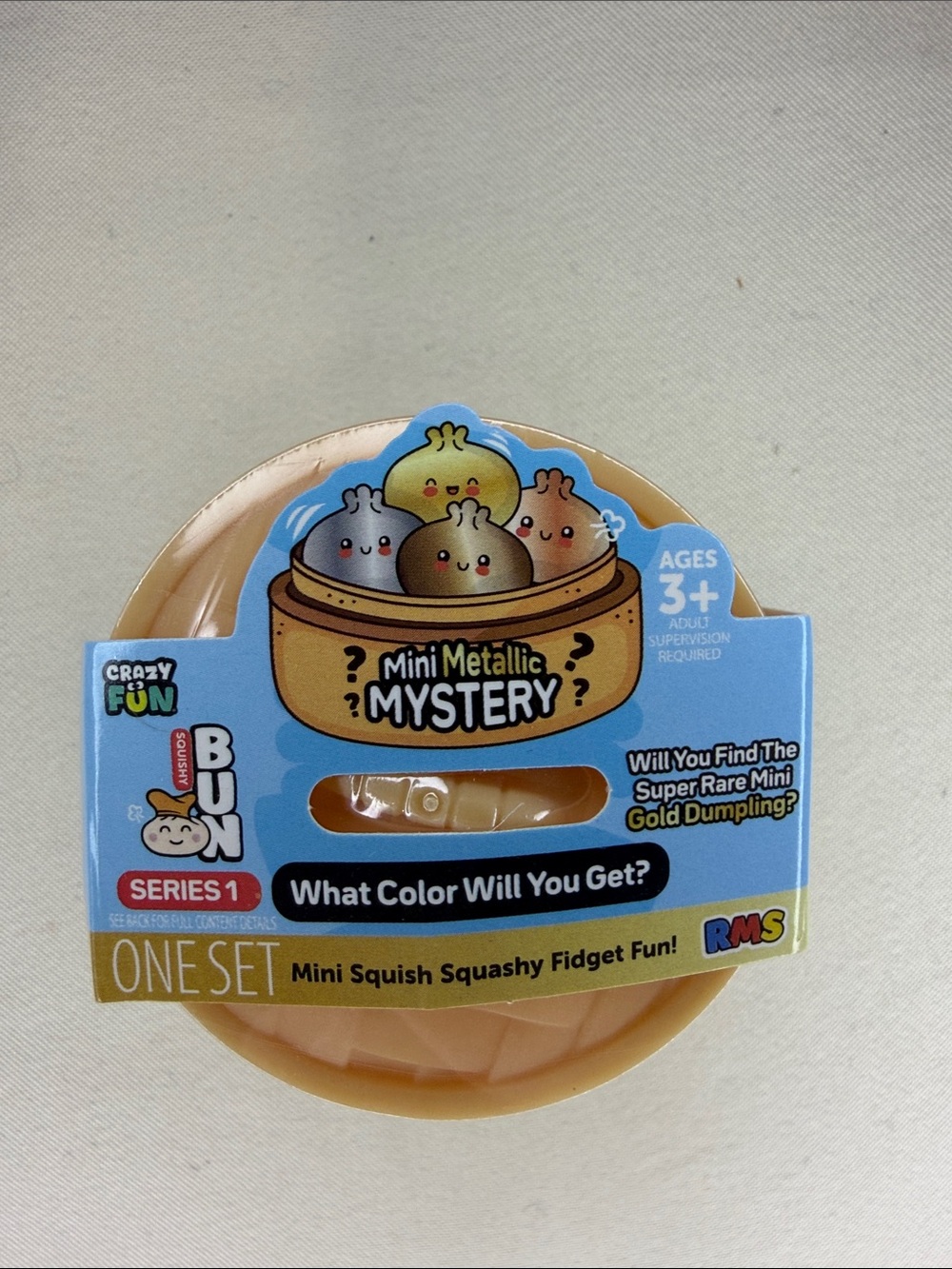 Mini Metallic Mystery Dumpling Mini Squish Fidget - Blue & Gold Packaging